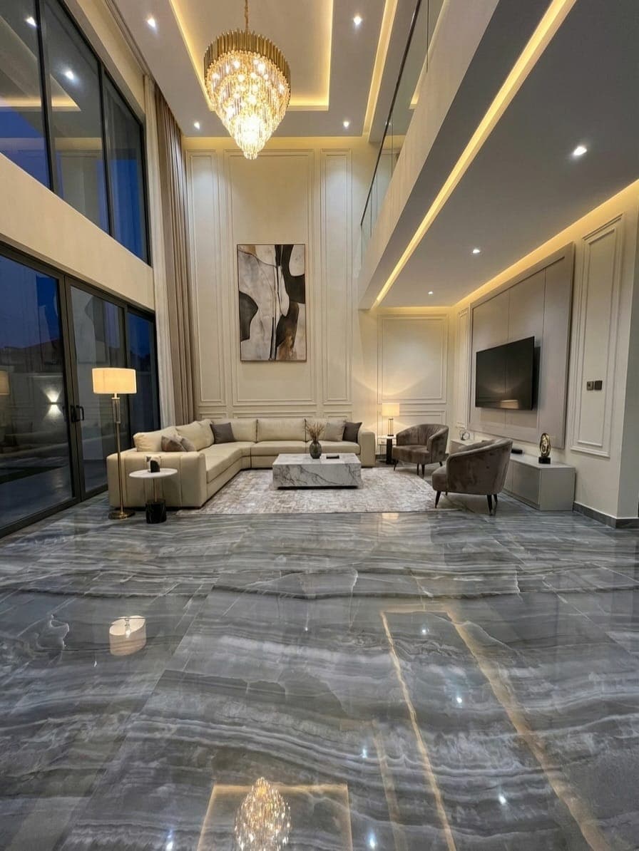 Marble-effect flooring installed in a double-height villa living room